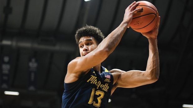 Marquette Golden Eagles forward Oso Ighodaro secures a rebound.